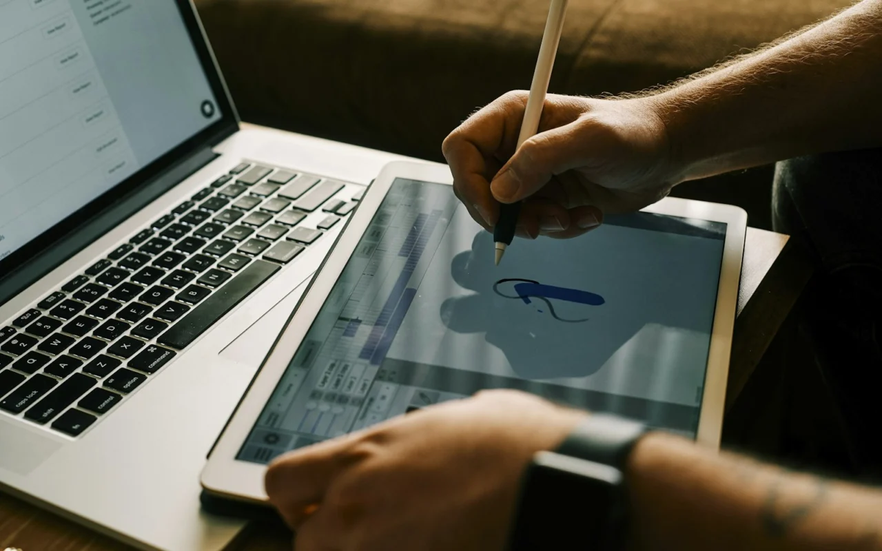 Creator editing a website on a laptop