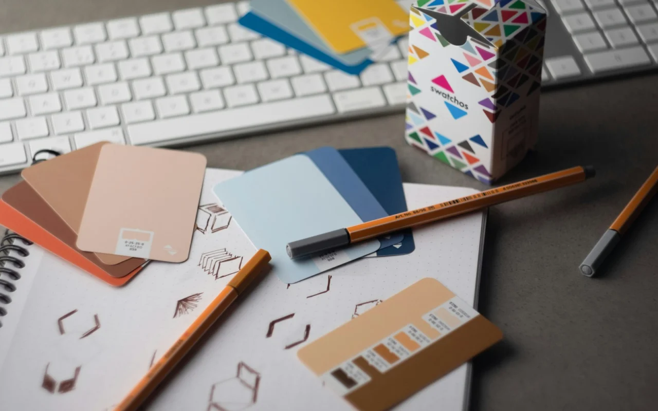 Designer comparing colour swatch cards for a brand identity